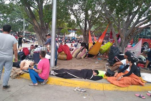 Venezuelans returning to their country wait in an overcrowded quarantine center (called PASI) set up by Venezuelan authorities at a San Antonio del Táchira bus terminal, April 2020.
