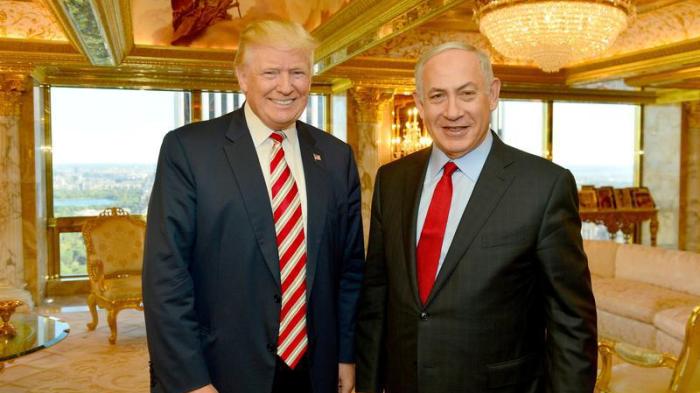 Israeli Prime Minister Benjamin Netanyahu (R) stands next to Republican U.S. presidential candidate Donald Trump during their meeting in New York, September 25, 2016. 