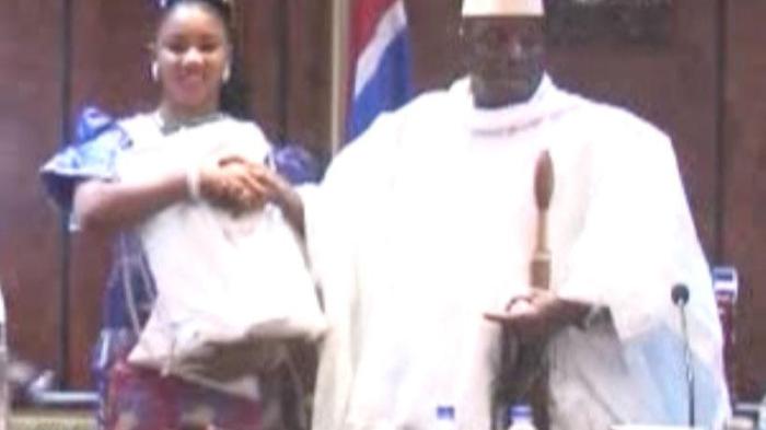 Fatou (Toufah) Jallow receiving the award from President Yahya Jammeh as winner of the Miss July 22 Pageant. Banjul, Gambia, December 24, 2014. Jallow alleges that Jammeh raped her after she refused his advances.