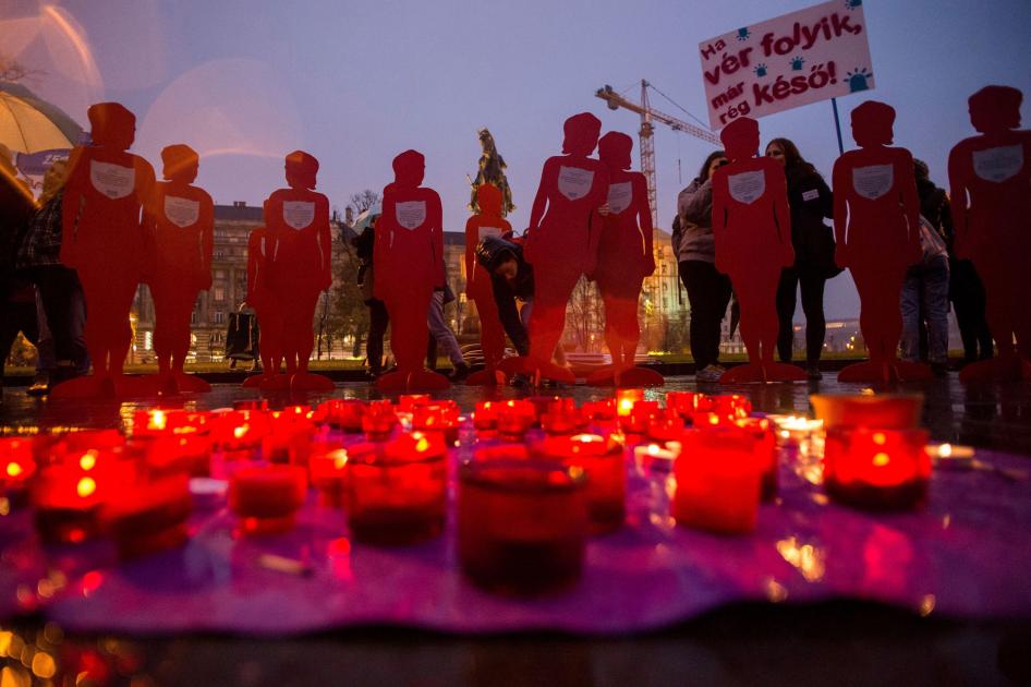 Candles and silhouettes representing victims are placed during a rally to mark the International Day for the Elimination of Violence Against Women outside the Parliament in Budapest, Hungary, November 25, 2018.