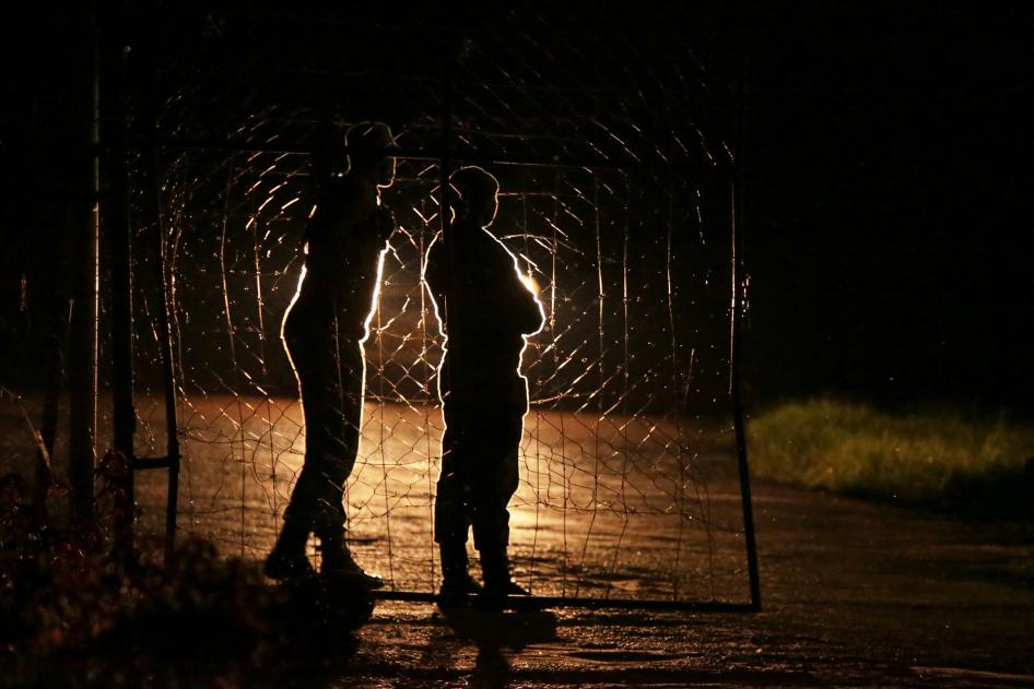 Armed Zimbabwean prison guards are seen at the entrance of Chikurubi prison on the outskirts of Harare, January 30, 2019.