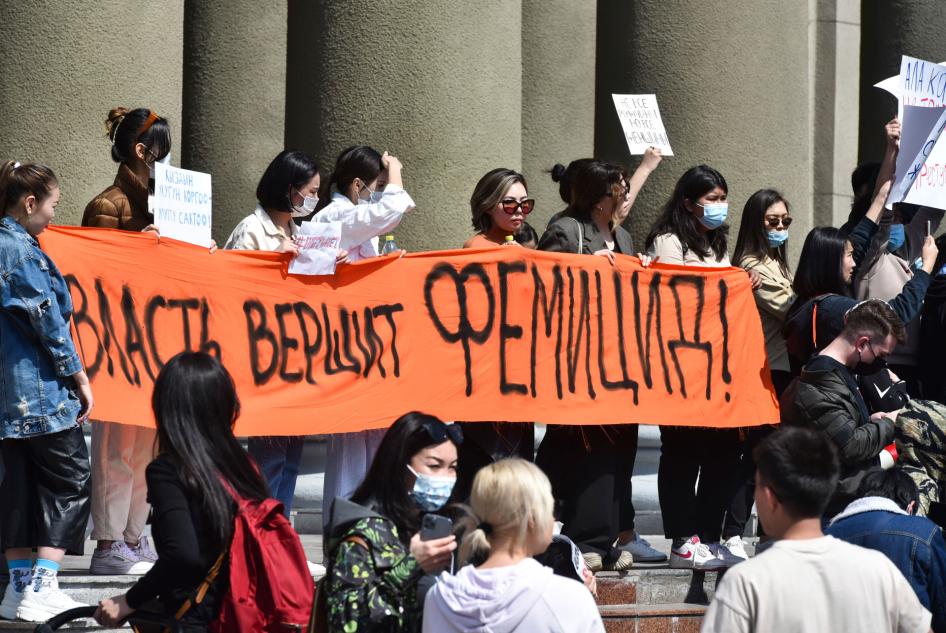 People attend a rally for the protection of women's rights in Bishkek, Kyrgyzstan, protesting the kidnapping and killing of Aizada Kanatbekova, April 8, 2021. The banner reads, "The Authorities are Responsible for Femicide."