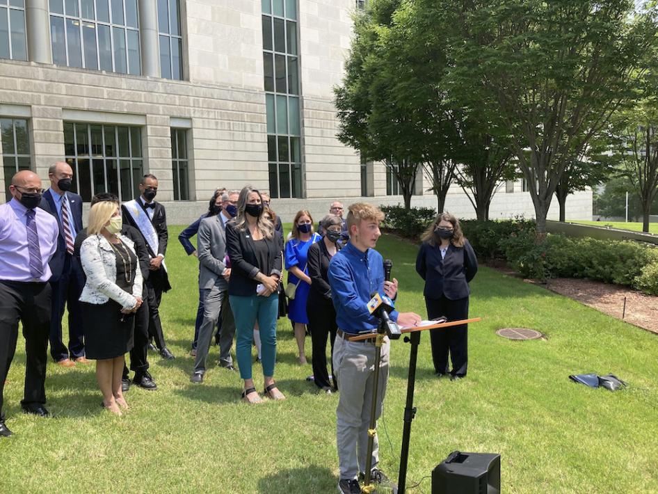 Dylan Brandt speaks at a news conference outside the federal courthouse in Little Rock, Arkansas, US, July 21, 2021.