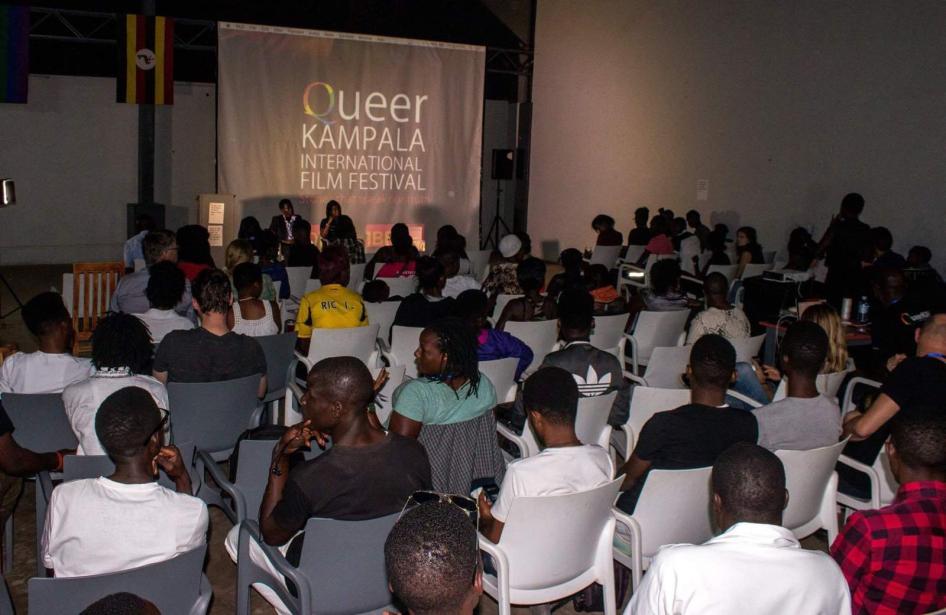 Audience members watch films screened during the sold-out opening night of the 2017 Queer Kampala International Film Festival. Police raided and forcibly closed the festival on December 9, 2017. 