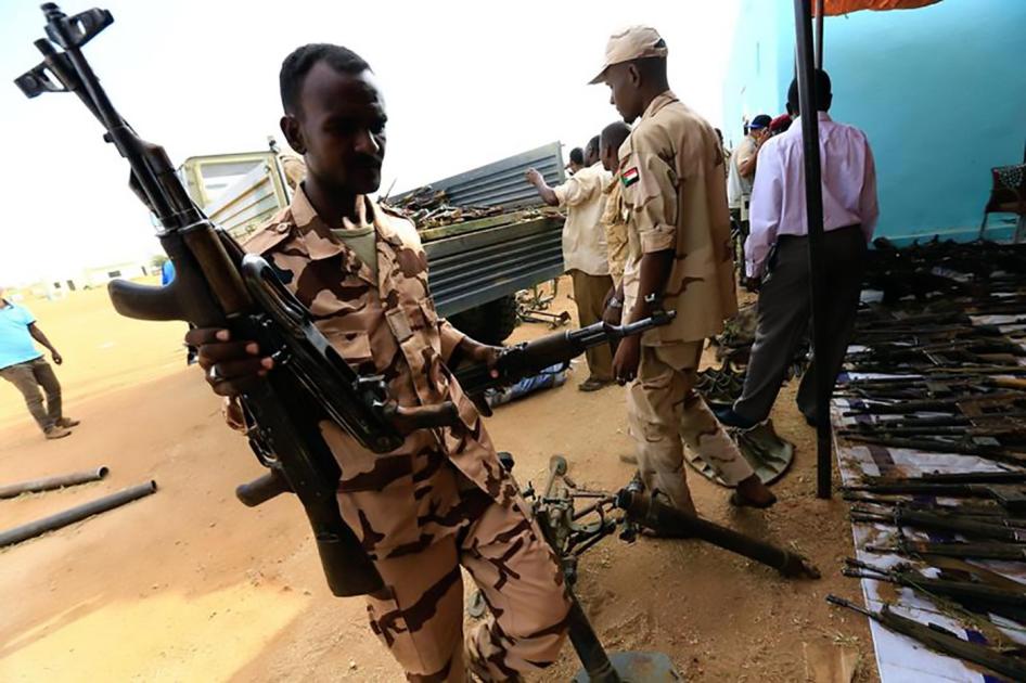 Rapid Support Forces upload disarmed weapons for display during Sudanese President Omar al-Bashir visit to the war-torn Darfur region at Rapid Support Forces Headquarter in Umm Al-Qura, Darfur, Sudan September 23, 2017.