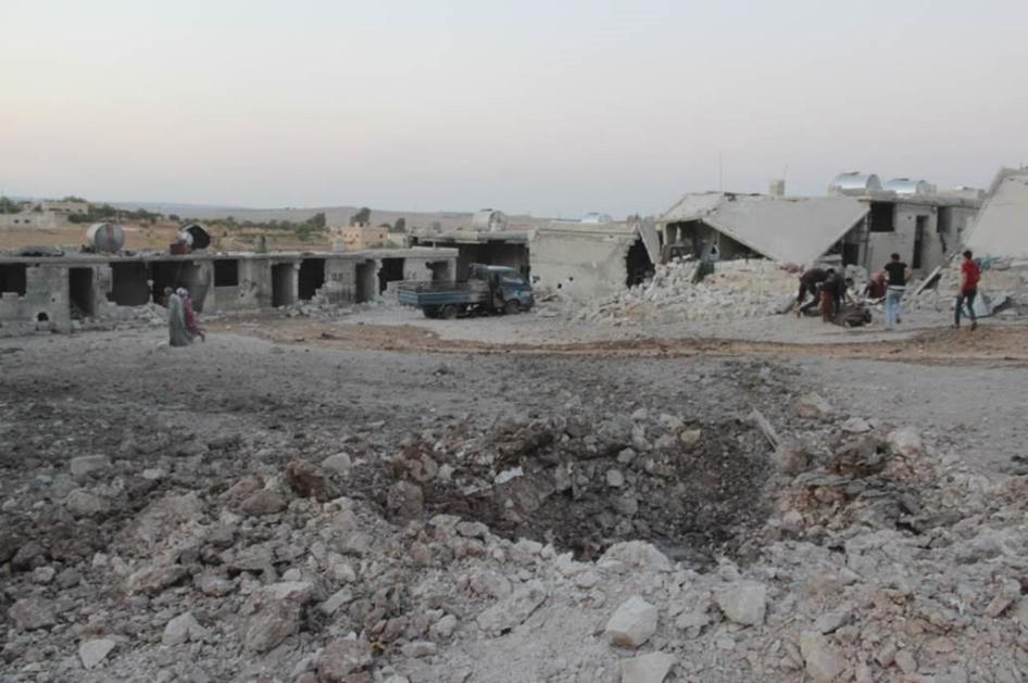Large crater made by the impact of the munition dropped in the August 16, 2019 strike on the displacement center in Hass, Syria. 