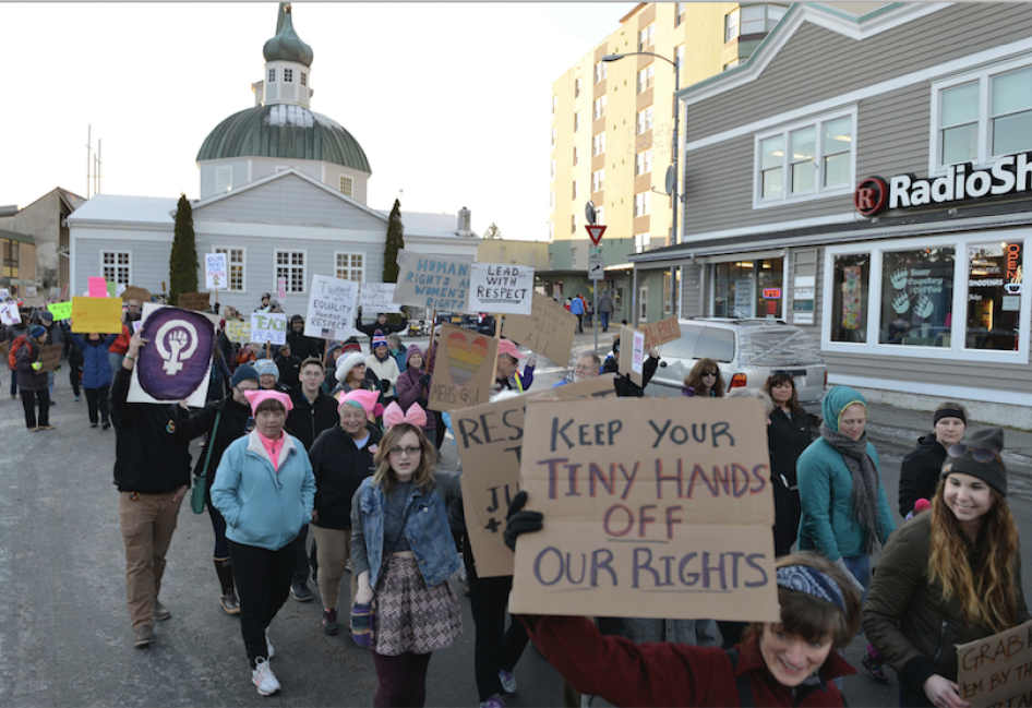 Hundreds of people march in downtown Sitka, Alaska, during the women's march, held in solidarity with the Women's March on Washington, Saturday, Jan. 21, 2017. 