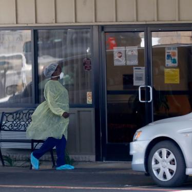 A worker walks in to the Paris Healthcare Center in Paris, Texas, April 29, 2020.