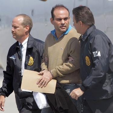 Colombian paramilitary warlord Salvatore Mancuso is escorted by US DEA agents on May 13, 2008 upon his arrival to Opa-locka, Florida.
