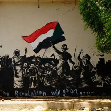 A mural reading, "The Revolution will go on" is seen on a wall in Khartoum, Sudan, June 18, 2019.