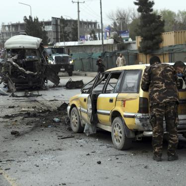 Security personnel inspect the site of a bomb attack in Kabul, Afghanistan on Monday, March 15, 2021. 