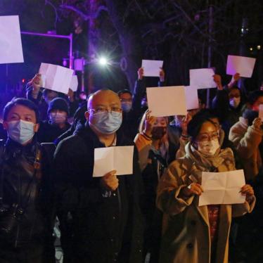 Protesters hold up blank sheets of white paper