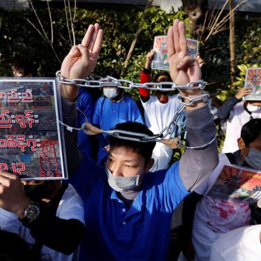 A Myanmar protester raises three-finger salutes during a rally to mark the second anniversary of Myanmar's 2021 military coup, outside Myanmar’s embassy in Tokyo, Japan.