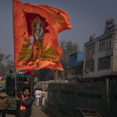 A man waves a flag with the Hindu god Ram to celebrate the opening of the Ram Temple in Ayodhya city, India, January 16, 2024.