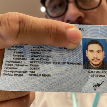  In Indonesia, a believer in Judaism shows his new ID card with the religious column, "Belief in the one God."