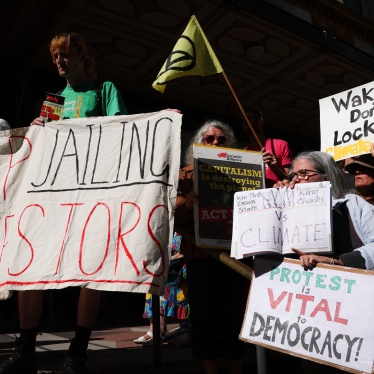 Protesters rally in support of climate activist Deanna "Violet" Coco, who was sentenced to jail for helping to block the Sydney Harbour Bridge, outside the Downing Centre court building in Sydney, Australia, December 13, 2022. 