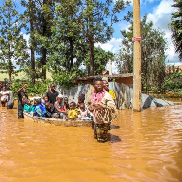 A family uses a boat after fleeing floodwaters that wreaked havoc in the Githurai area of Nairobi, Kenya, April 24, 2024.