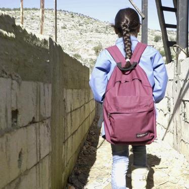 Bara’a, 10, originally from Ghouta, Syria, leaves for school from her informal refugee camp in Mount Lebanon. 