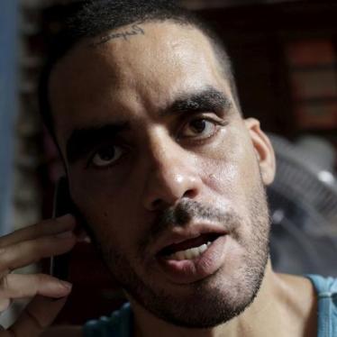 Cuban graffiti artist Danilo Maldonado speaks on his cellphone in his house in Havana on October 20, 2015. 