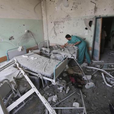 A Palestinian medic inspects a damaged room at Al-Aqsa Martyrs hospital, in Deir el-Balah, central Gaza Strip, after the building was shelled by the Israeli army on July 21, 2014, killing at least 3 people and wounding about 40 others.