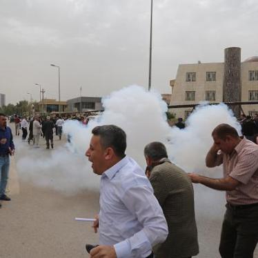 Riot police use teargas to disperse hundreds of civil servants who gathered during a protest against reduced monthly salaries in Erbil, Iraq on March 25, 2018. © 2018 Hemn Baban/Anadolu Agency/Getty Images