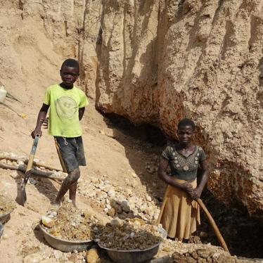 "Peter," 15, working alongside a teenage girl at an artisanal and small-scale mine in Odahu, Amansie West district, Ghana. 