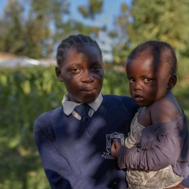 “Evelina,” 17, with her 3-year-old daughter “Hope,” in Migori county, western Kenya. Evelina is in Form 2, the second year of lower secondary school. 