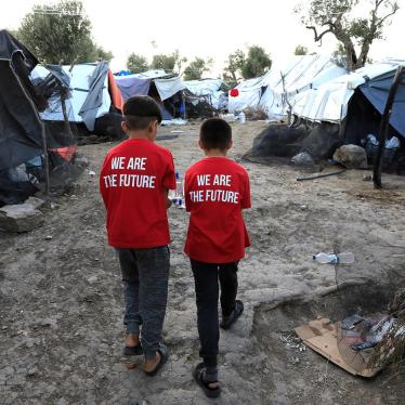 Two boys walk in a makeshift camp next to the Moria camp for refugees and migrants on the island of Lesbos, Greece, September 17, 2018. 