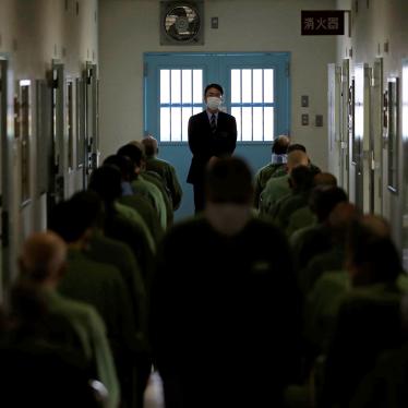 A prison officer stands in front of older inmates who attend slow-paced exercises in a special building set aside for prisoners unable to do regular prison factory work, at the prison in Tokushima, Japan, March 2018. 