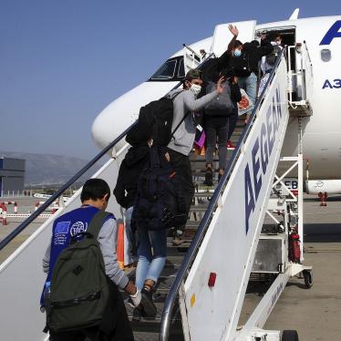 Migrant children board a plane for Luxembourg