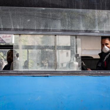 A man wearing a face mask rides in an almost empty bus in Cairo, Egypt, March 30, 2020.