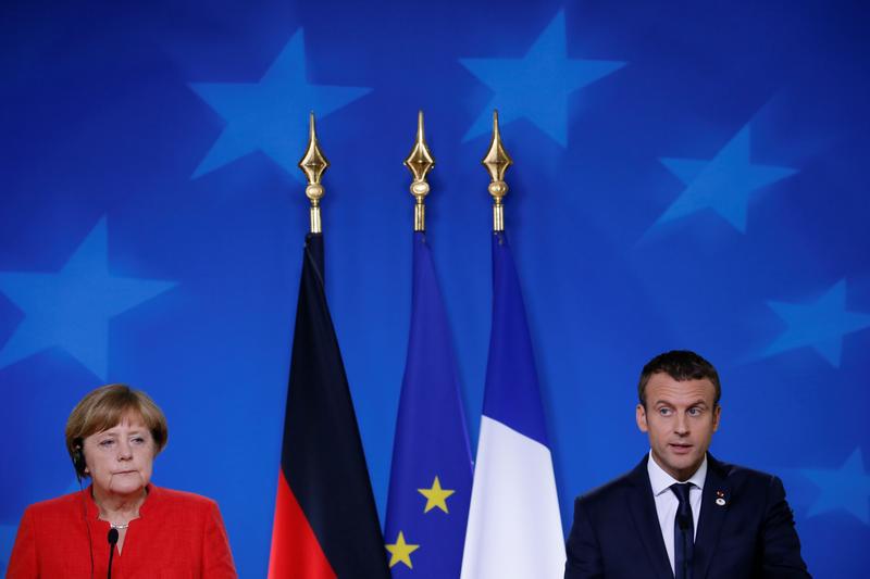 Die deutsche Bundeskanzlerin Angela Merkel und der französische Präsident Emmanuel Macron auf einer gemeinsamen Pressekonferenz auf dem EU-Gipfel in Brüssel, Belgien, 23. Juni 2017.