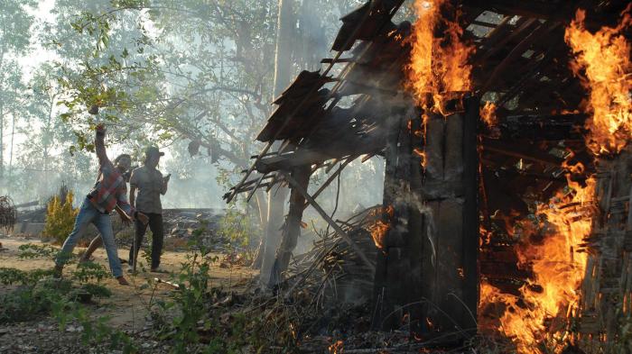  Militants burn down Shia houses on August 26, 2012, in the village of Nangkernang in Sampang regency, Madura Island. Hundreds of Sunni militants associated with the Ulema Consensus Forum torched around 50 Shia homes that day.