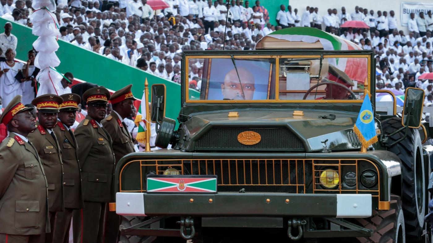 A portrait of Burundi's late president Pierre Nkurunziza sits in the front seat of the military vehicle carrying his coffin at his state funeral in Gitega, Burundi, June 26, 2020.