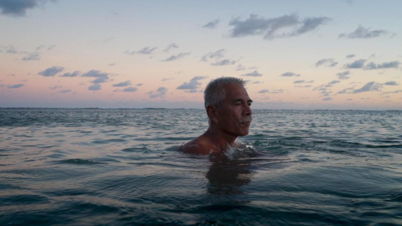Anote Tong, then president of Kiribati, swims in the lagoon near his home.
