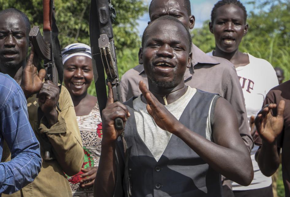 FILE: Opposition soldiers chant "Viva IO", meaning "long live the opposition", during a visit in August 2019 by a ceasefire monitoring team, at an opposition military camp near the town of Nimule in Eastern Equatoria state, South Sudan. 
