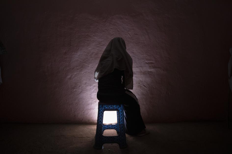 A Tigrayan refugee survivor of rape who fled the conflict in Ethiopia's Tigray sits for a portrait in eastern Sudan near the Sudan-Ethiopia border, on March 20, 2021.