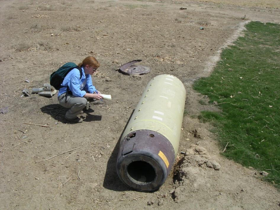 Bonnie Docherty examining a US ATACMS cluster munition outside of al-Hilla dropped on Iraq in May 2003.