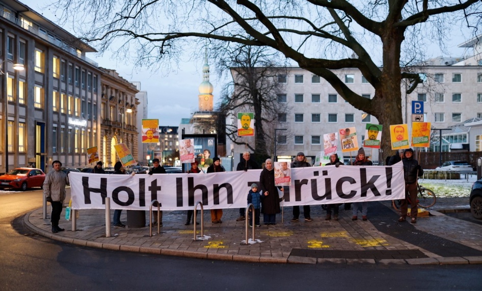 A vigil on 18 January 2024 in Dortmund, Germany, on the anniversary of the deportation of Tajikistan opposition activist Abdullohi Shamsiddin. The banner reads: ‘Bring Him Back!’