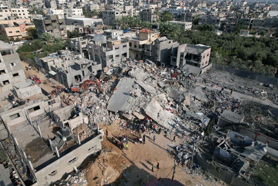 An aerial view of Gaza civil defense teams and residents launching a search-and-rescue operation after the Israeli strike on the Engineers’ Building on October 31, 2023. 