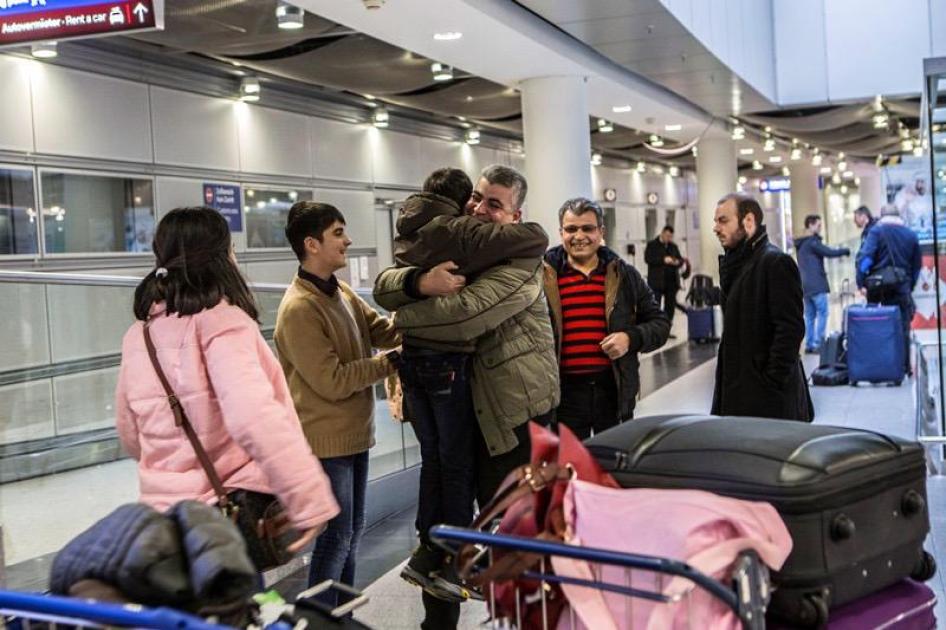 Mohammed meets his children and his wife in Dusseldorf airport, Germany, almost two years after he decided to come to Europe as a refugee. © 2017 Anna Pantelia