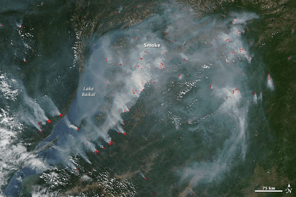 Satellite imagery that showing active wildfires (outlined in red) and smoke near the shoreline of Lake Baikal in southern Russia, July 27, 2017. The Russian environmental group Baikal Environmental Wave was deemed a "foreign agent" organization because it