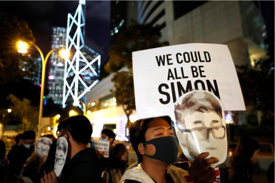 A protester holds a sign reading "We could all be Simon" in reference to Simon Cheng, a Hong Kong British Consulate employee who was detained in China, during a rally outside of the British Consulate in Hong Kong, November 29, 2019. 