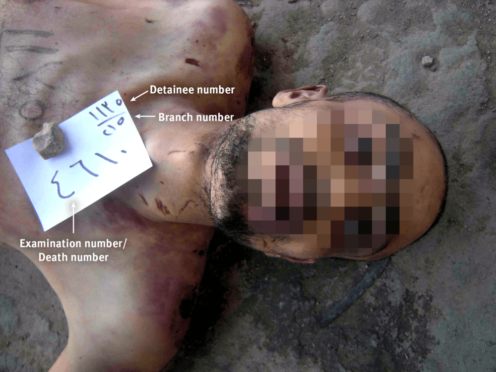 Syria Caesar photo: victim with card