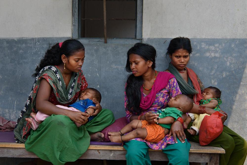 Manju M., 16, Tilmaya M., 18, and Sangeeta M., 19, wait with their children outside of a doctor’s office in Chitwan, Nepal. The parents of Manju M. arranged her marriage to a 19-year-old man when she was 15. Tilmaya M. eloped and married a 20-year-old man