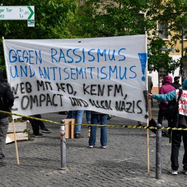 Calling our racism: Demonstrators gather to oppose messages of discrimination at protests over Covid -19 containment measures. The sign reads “Against racism and anti-Semitism”. Rosa-Luxemburg Platz, Berlin, 16 May 2020.