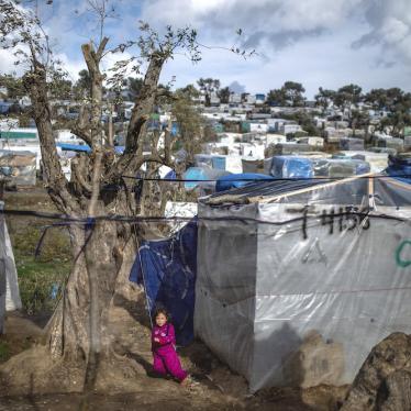 A child plays in a temporary tent camp near the camp for migrants in Moria, Lesbos which is overcrowded and lacks adequate hygiene facilities and sanitation, putting migrants, including pregnant people, at particular risk amid Covid-19