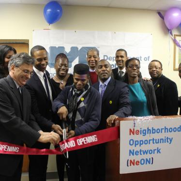 Former Commissioner Vincent Schiraldi and others cut a ribbon at the opening of the Neighborhood Opportunity Network at the New York City Department of Probation. 