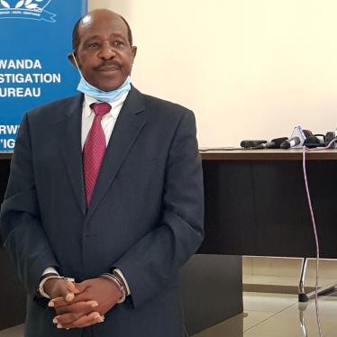 Paul Rusesabagina, who was detained on August 27, 2020, is paraded in front of the media in handcuffs at the headquarters of the Rwanda Investigation Bureau in Kigali, Rwanda on August 31.