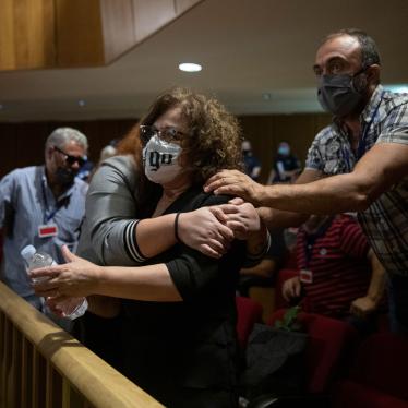 Magda Fyssa, the mother of late Greek rap singer Pavlos Fyssas, who was stabbed and killed by a supporter of the extreme right Golden Dawn party in 2013, celebrates immediately after the delivery of the verdict in Athens, October 7, 2020. 